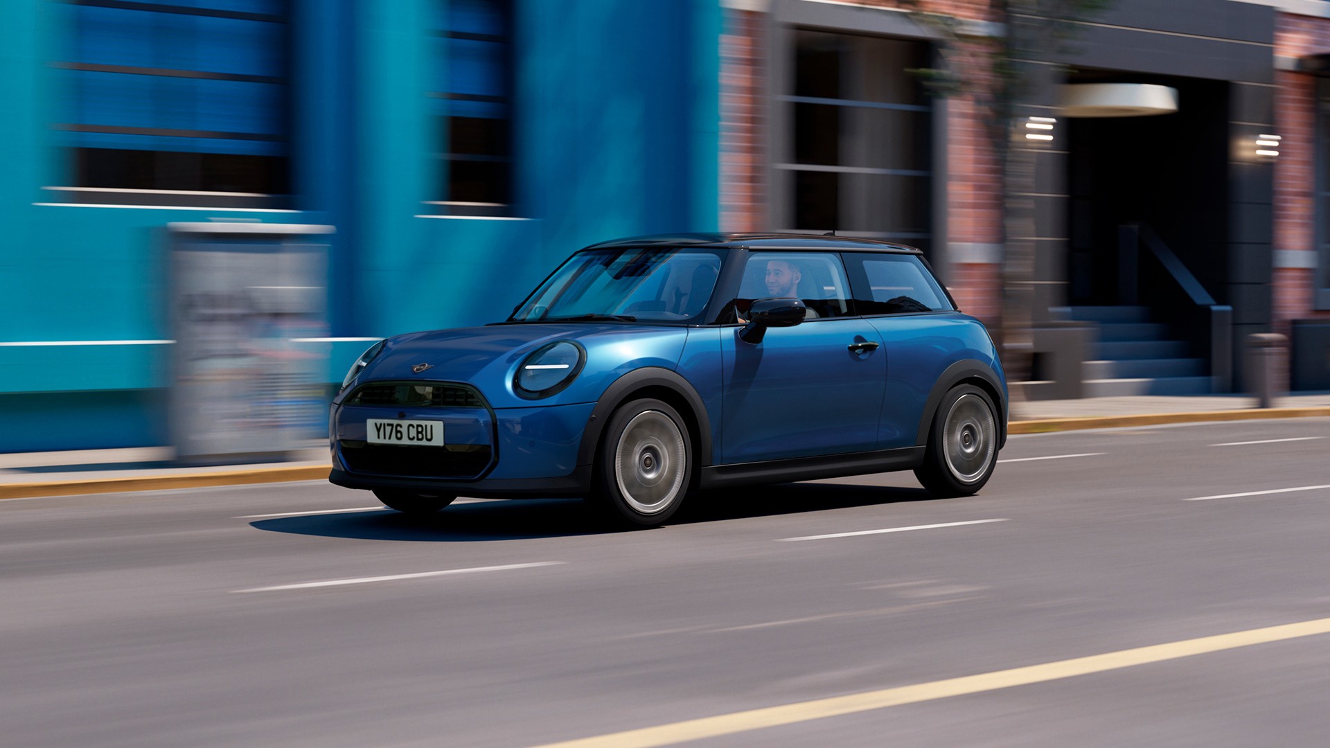 MINI Cooper speeds along a sunny street, with colourful buildings in the background, showcasing urban life.